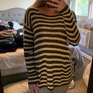 Striped dark green and white sweater.